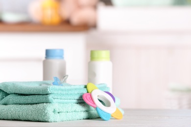 Set with baby accessories on table indoors, space for text