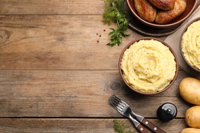 Photo of Flat lay composition with tasty mashed potatoes on wooden table. Space for text