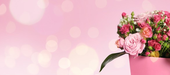 Image of Bouquet of beautiful flowers on pink background, space for text. Banner design