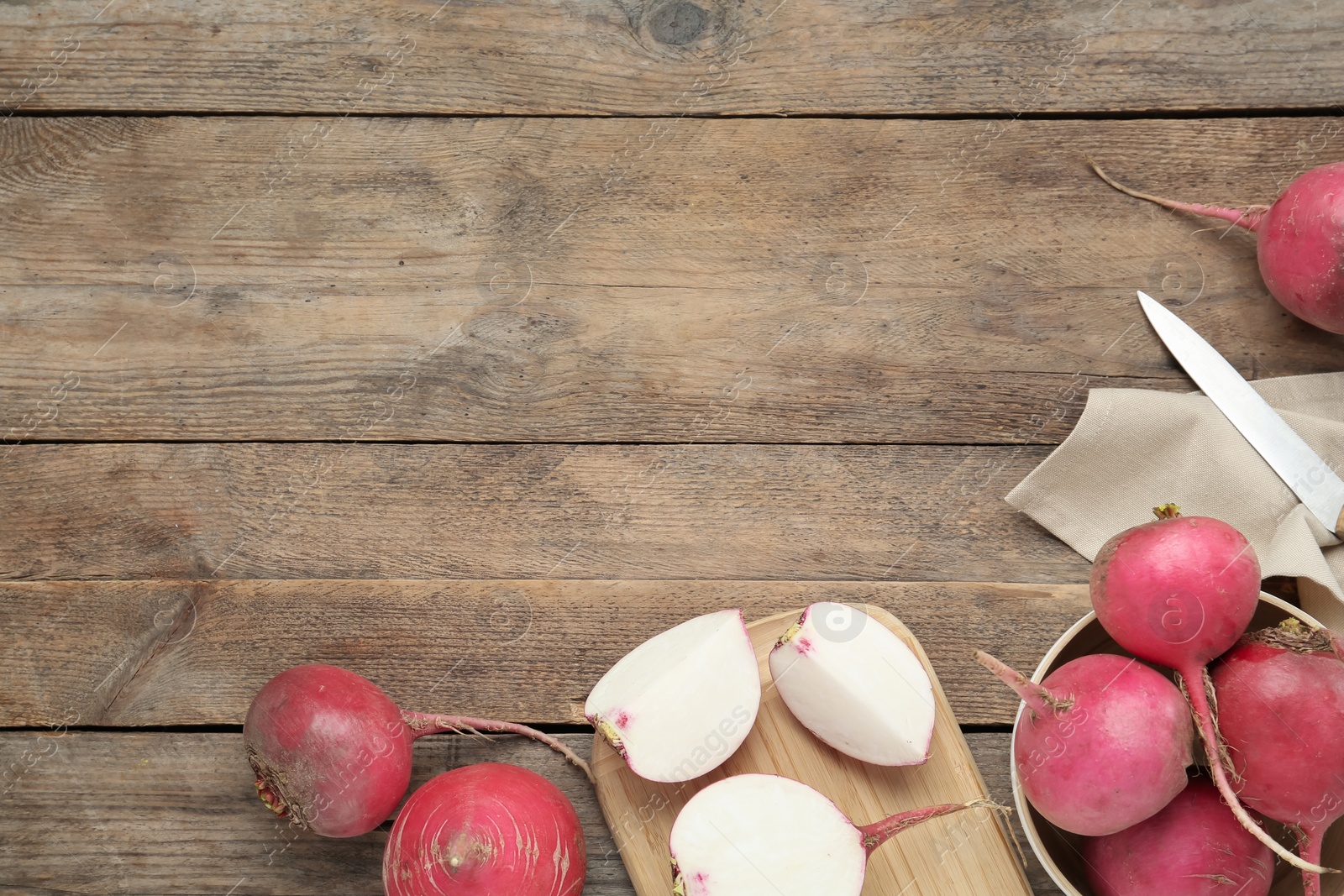 Photo of Raw red turnips on wooden table, flat lay. Space for text