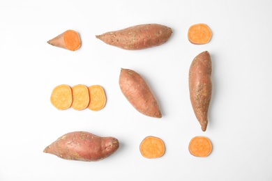 Photo of Composition with sweet potatoes on white background, top view