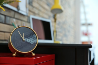 Alarm clock on table indoors. Time management