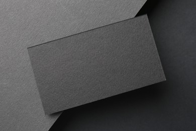 Photo of Blank business card on black background, top view. Mockup for design
