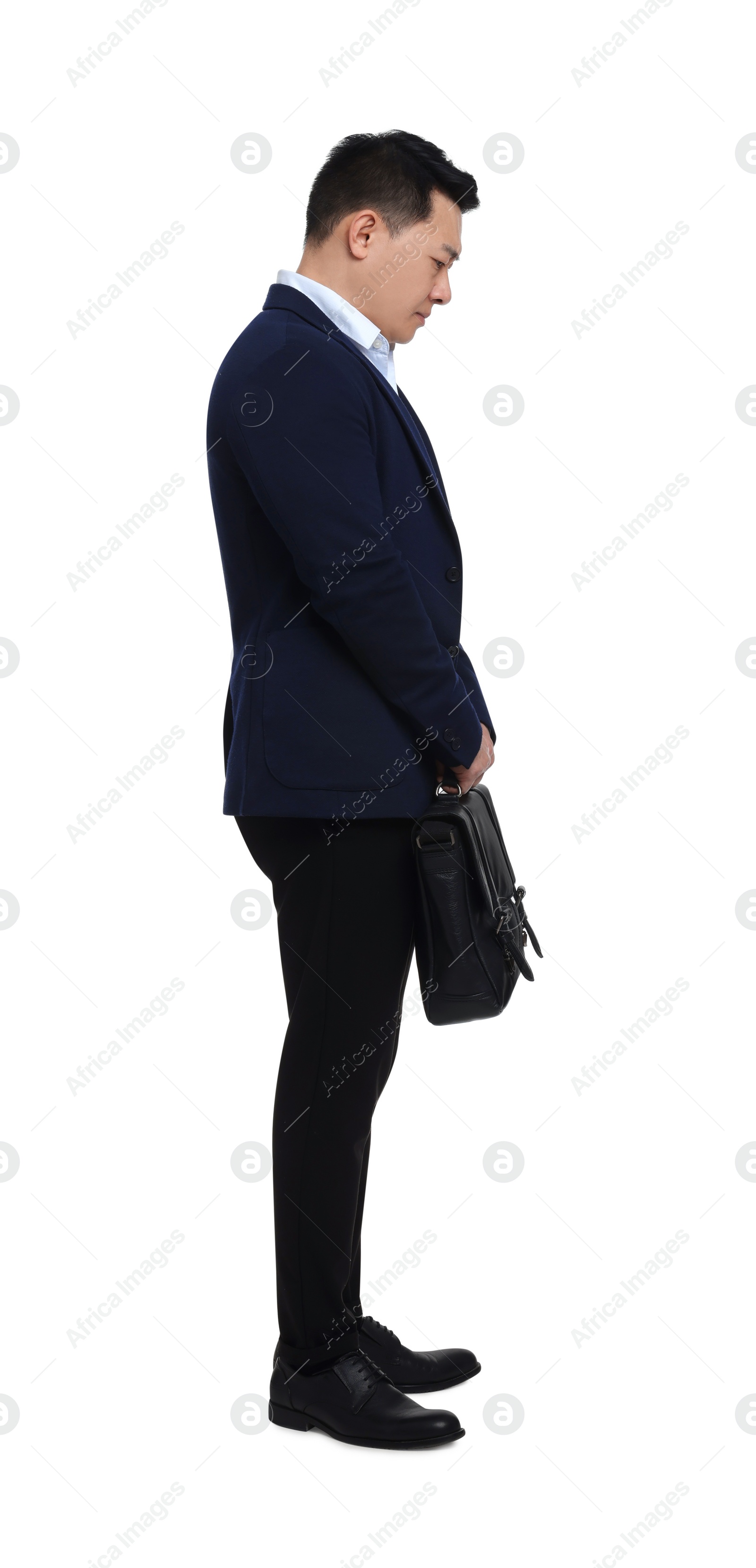 Photo of Tired businessman with briefcase posing on white background