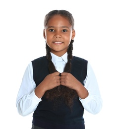 Happy African-American girl in school uniform on white background