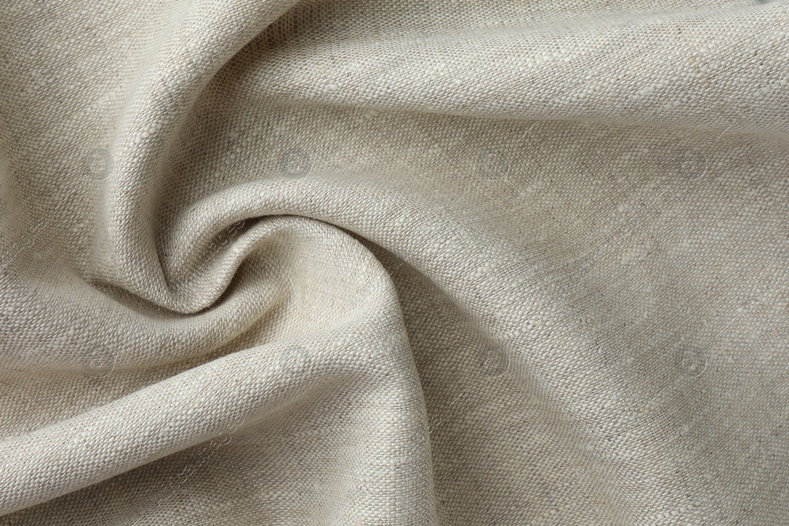 Photo of Texture of beige crumpled fabric as background, top view