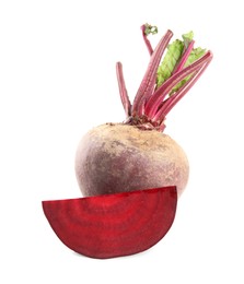 Photo of Whole and cut ripe beetroots on white background