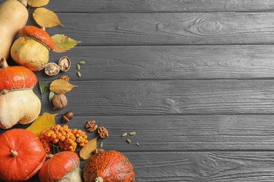 Photo of Orange pumpkins on wooden background, flat lay composition with space for text. Autumn holidays