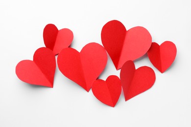 Photo of Paper hearts on white background, flat lay
