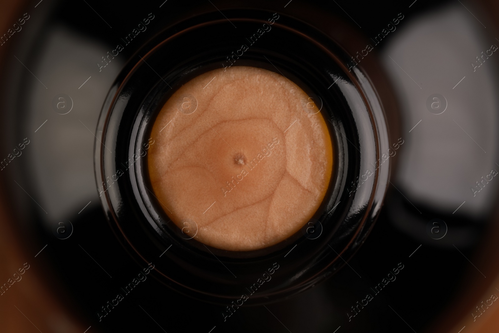 Photo of Wine bottle with cork as background, closeup