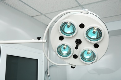 Photo of Powerful surgical lamps in modern operating room