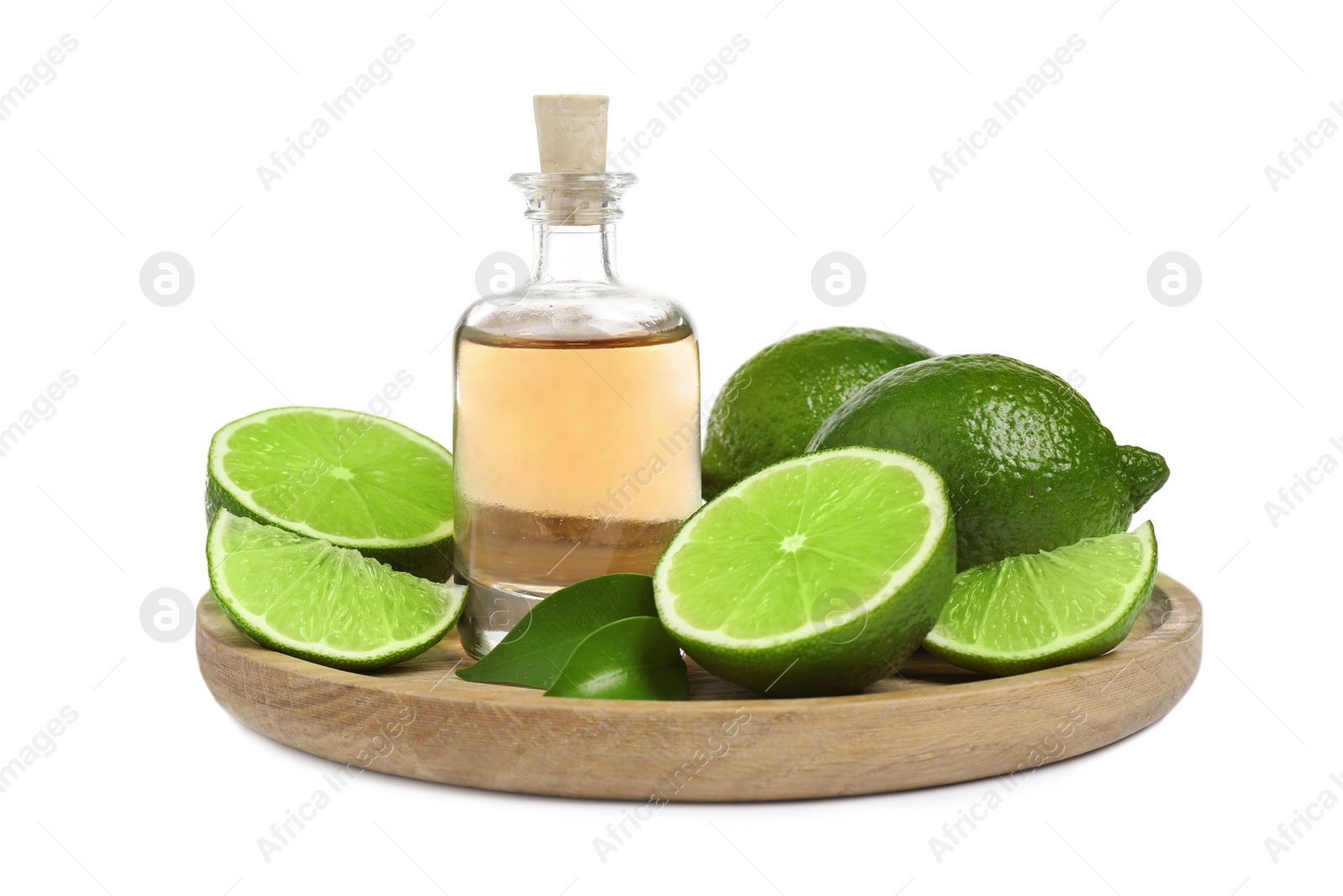 Photo of Lime essential oil in bottle and citrus fruits isolated on white