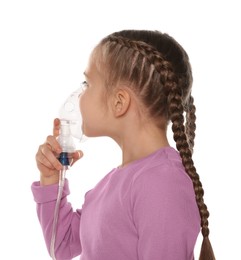 Photo of Little girl using nebulizer for inhalation on white background