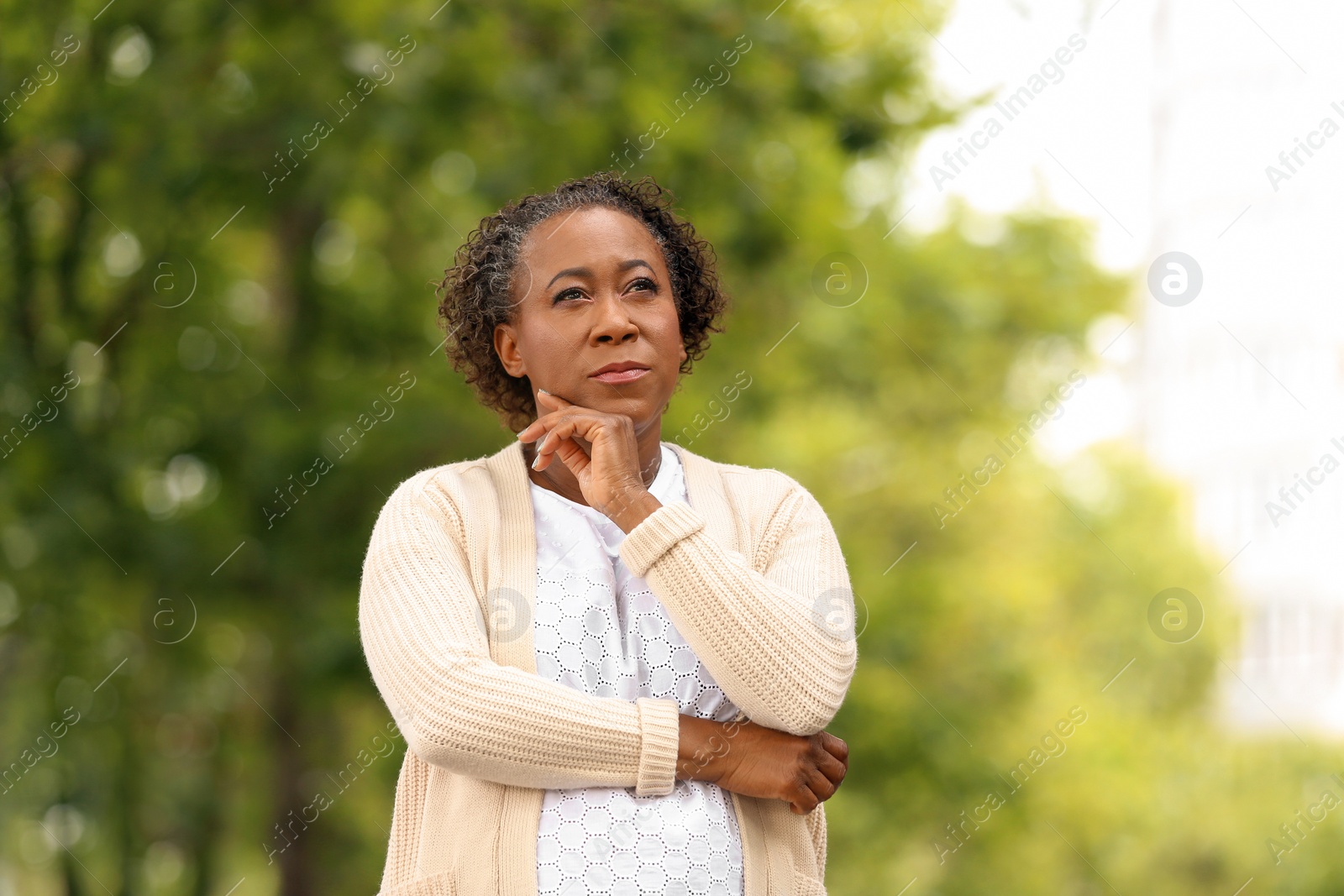 Photo of Portrait of happy African-American woman in park