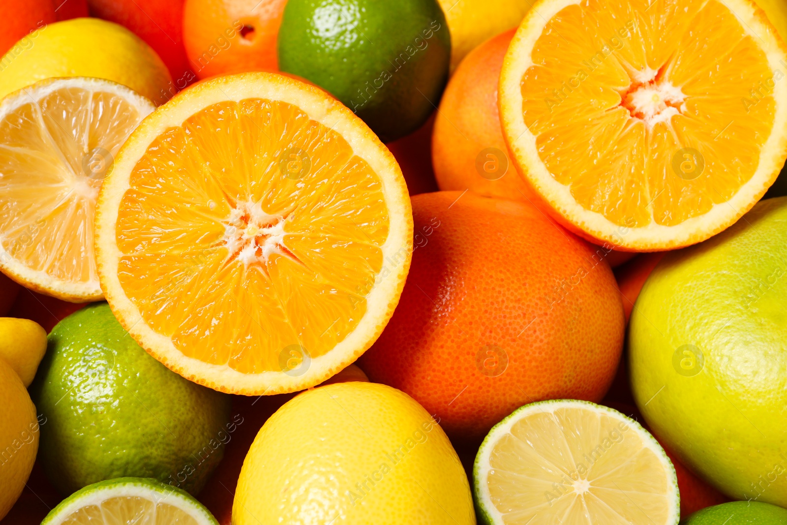 Photo of Different fresh citrus fruits as background, closeup