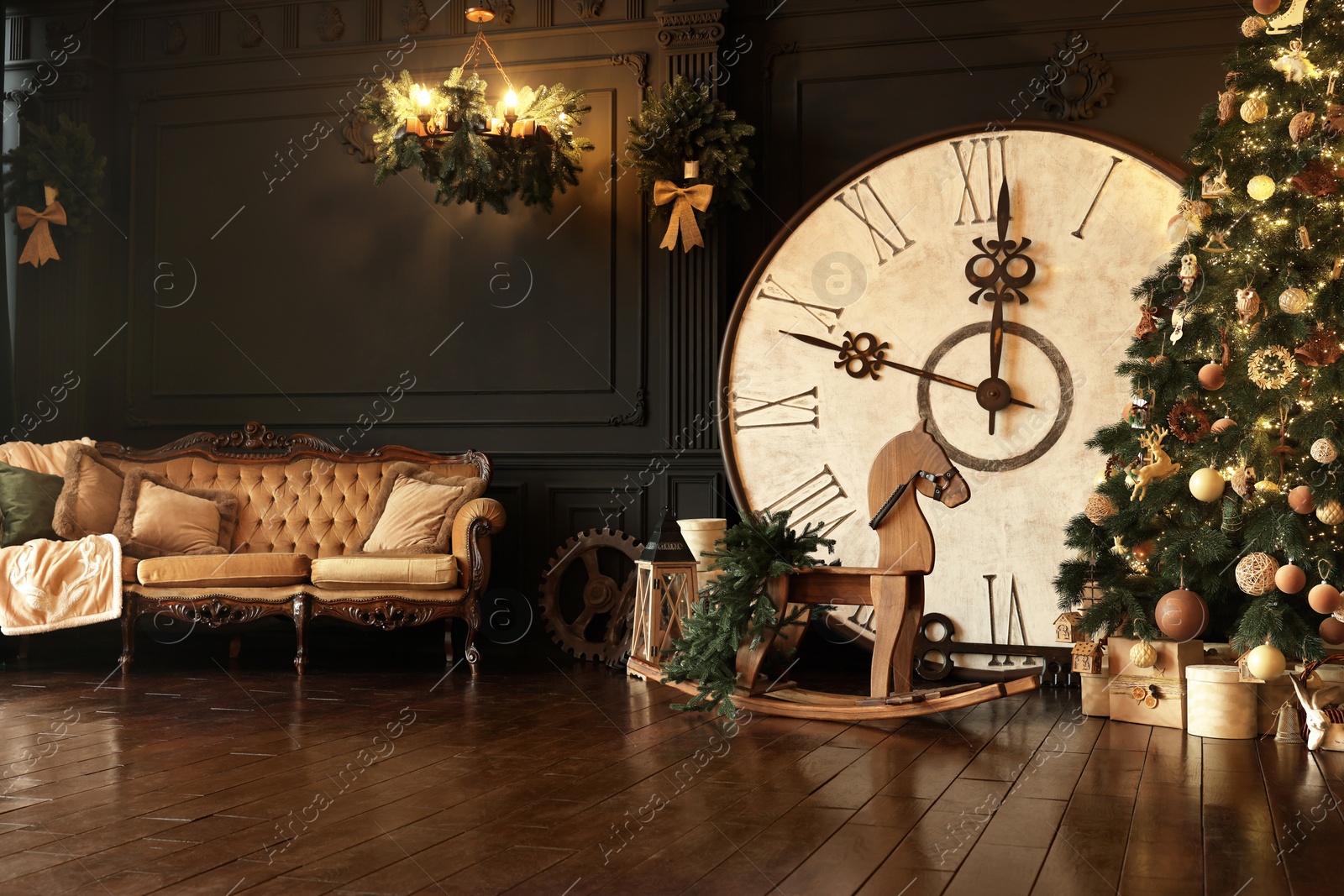 Photo of Stylish room interior with Christmas tree, big vintage clock and festive decor