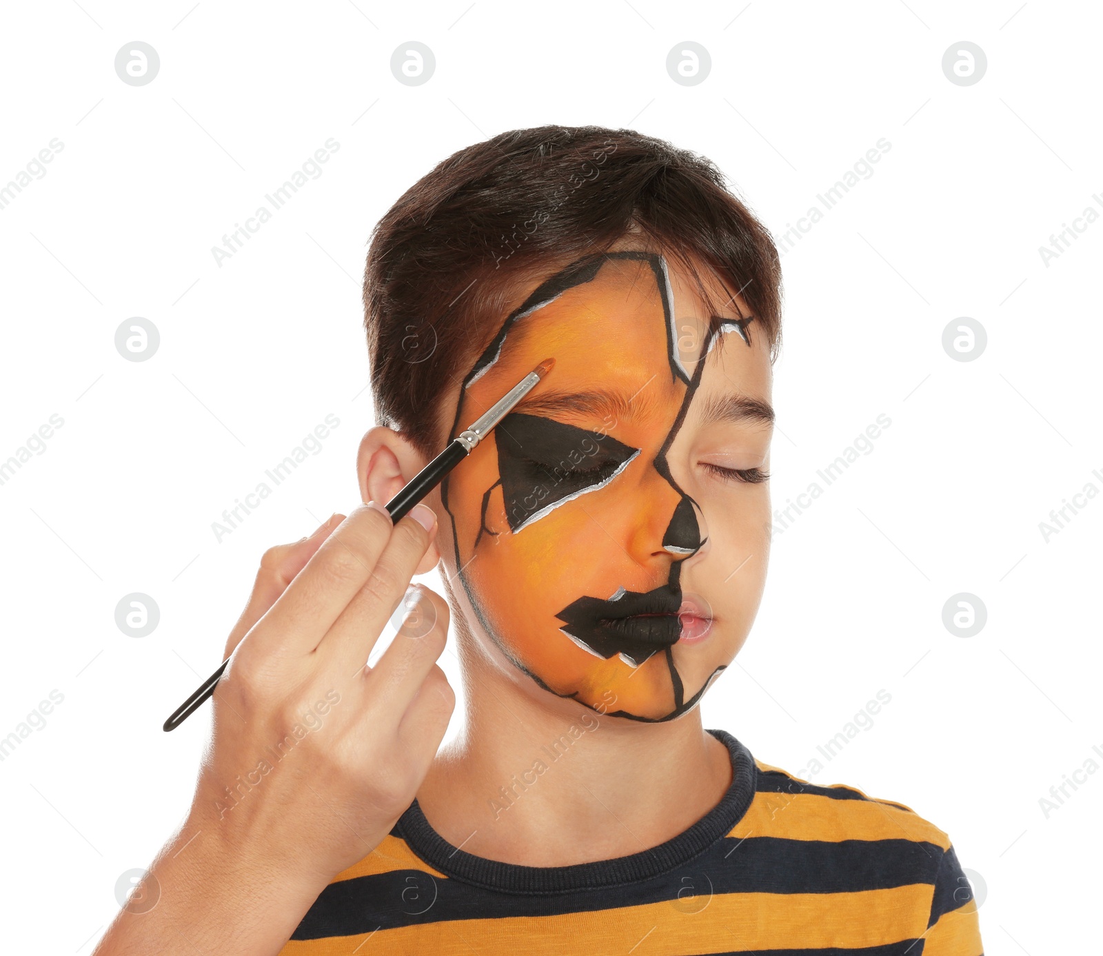 Photo of Artist painting face of little boy on white background