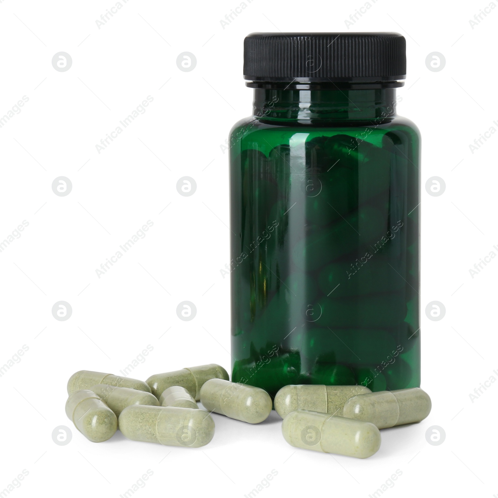 Photo of Bottle and pile of vitamin pills isolated on white