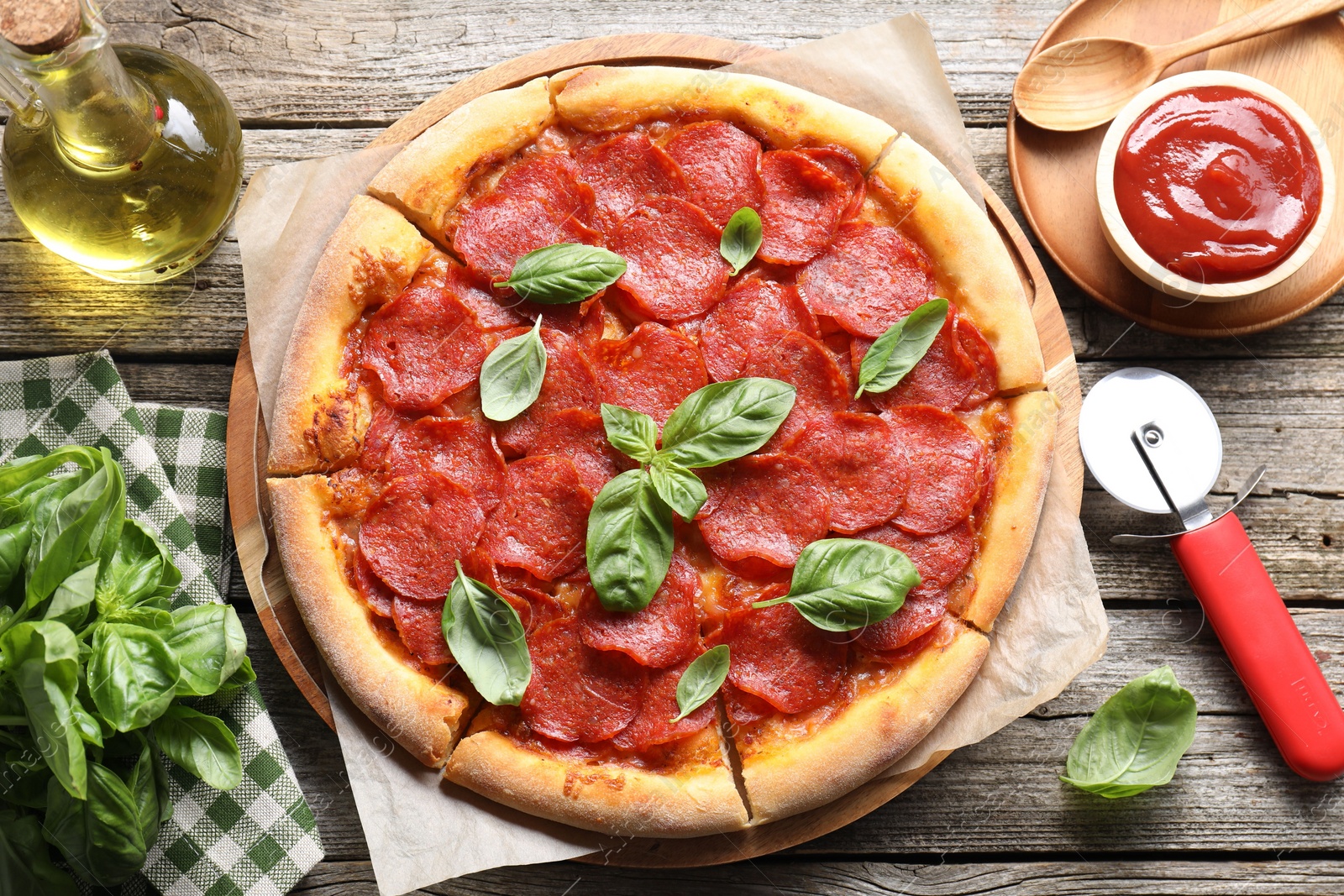 Photo of Flat lay composition with tasty pepperoni pizza on wooden table