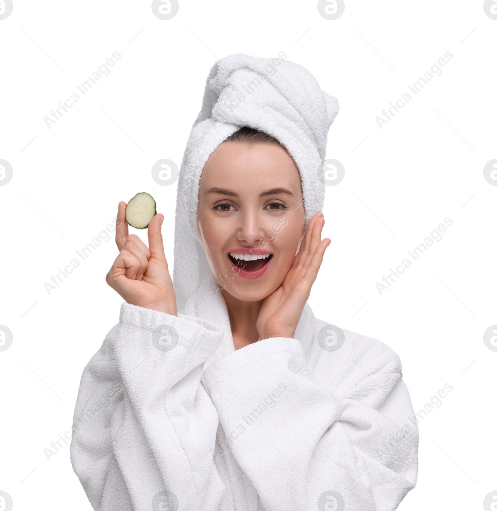 Photo of Beautiful woman in bathrobe with piece of cucumber on white background