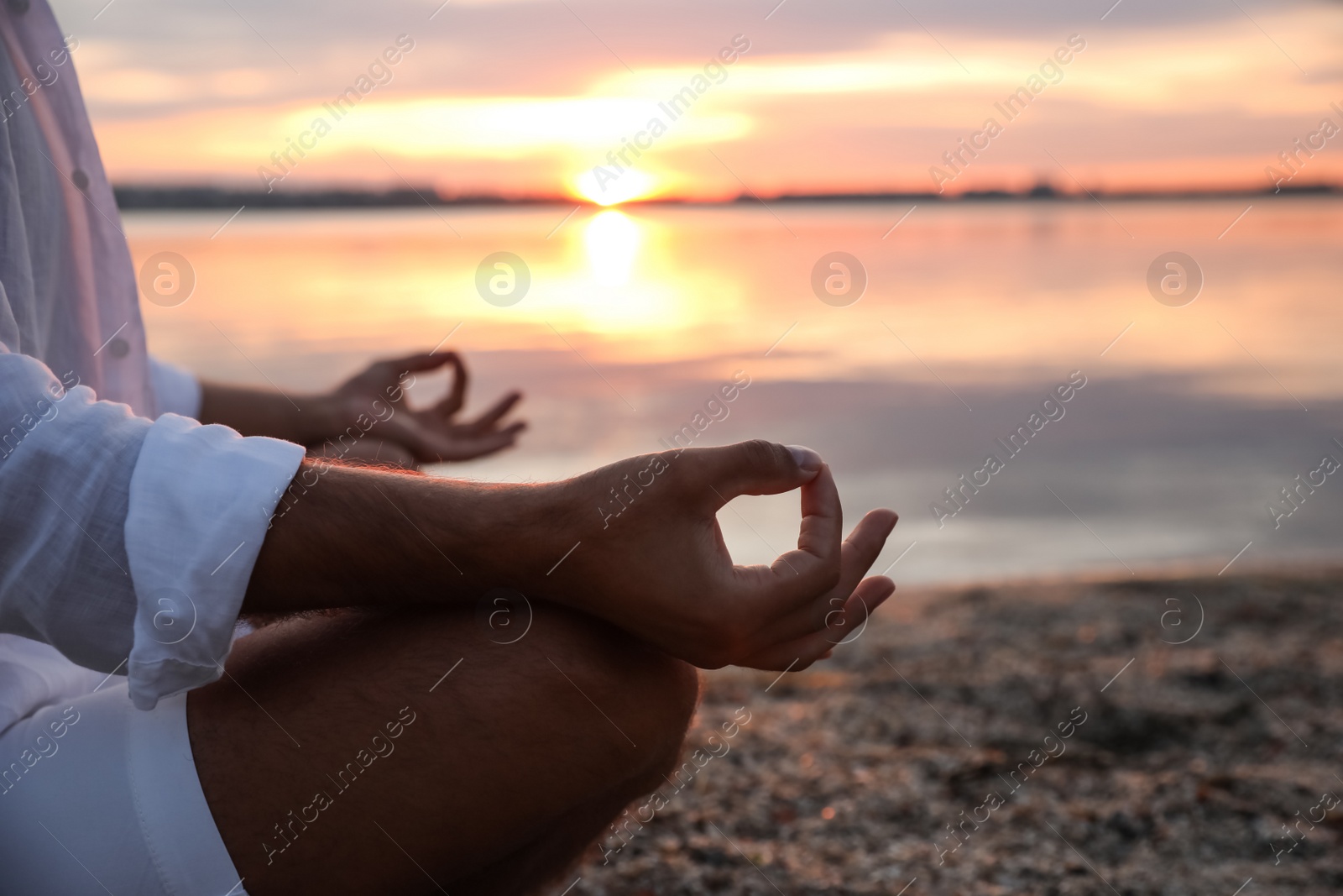 Photo of Man near river at sunset, closeup. Nature healing power