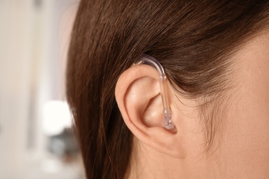 Young woman with hearing aid, closeup view