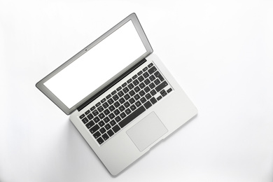 Photo of Modern laptop with blank screen isolated on white, top view