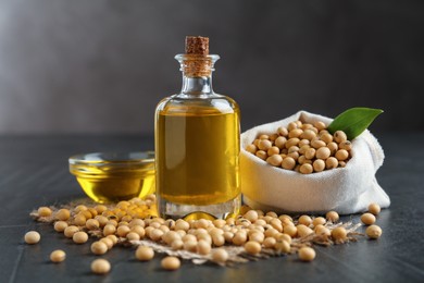 Photo of Composition with soybean oil on grey table