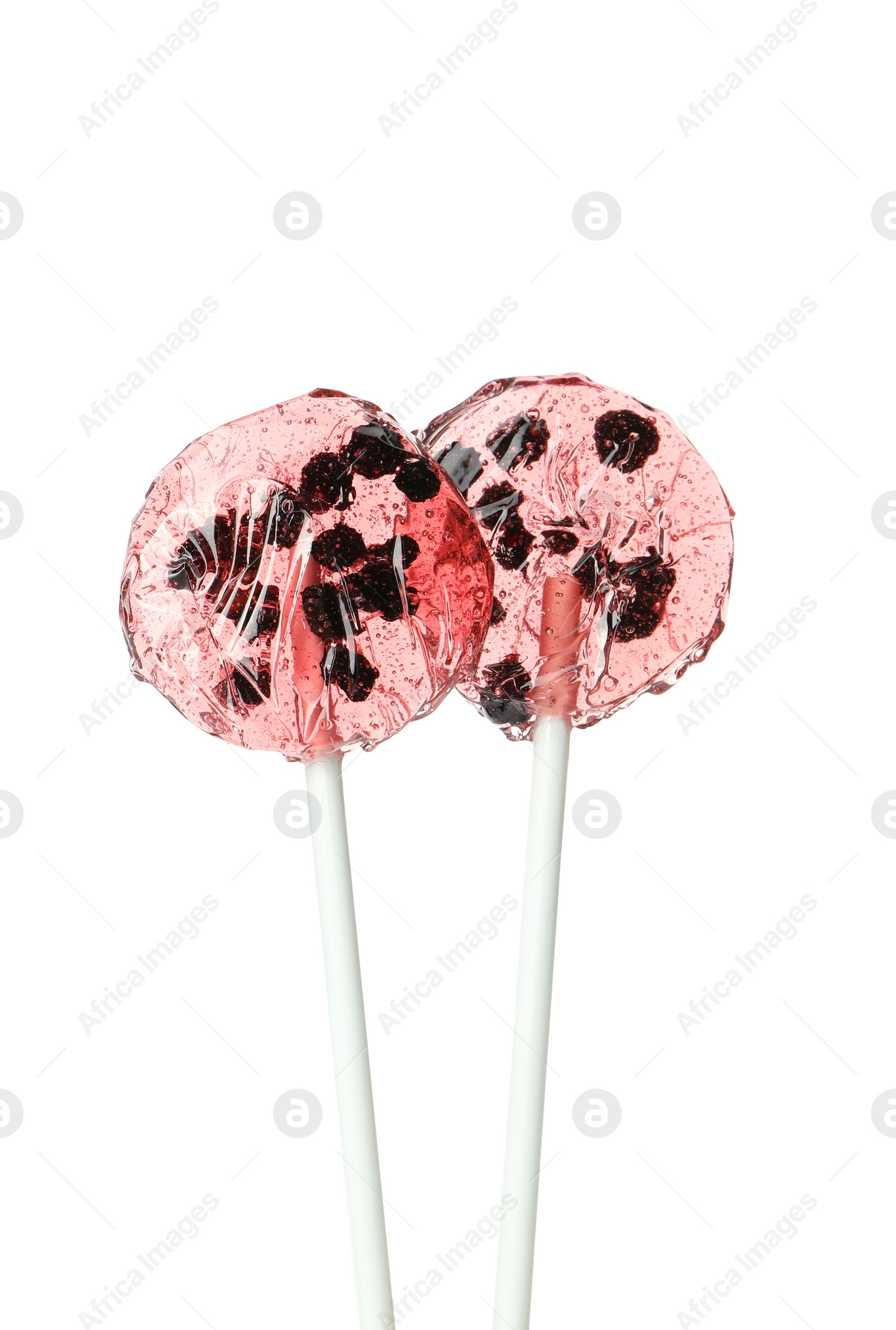 Photo of Sweet colorful lollipops with berries on white background