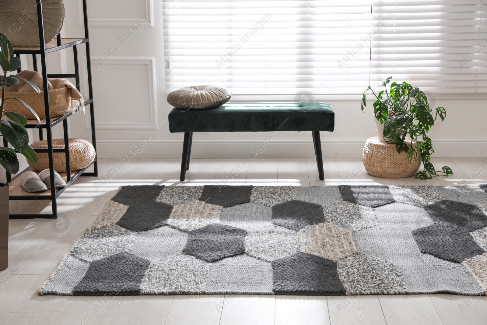 Photo of Stylish carpet with pattern on floor in room