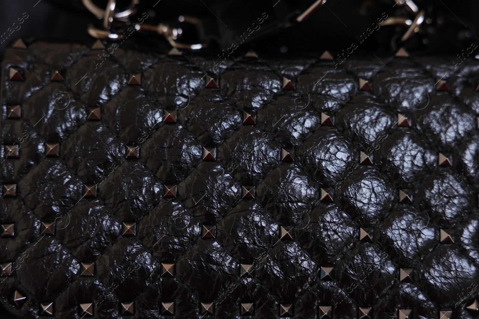 Photo of Texture of black leather bag as background, top view