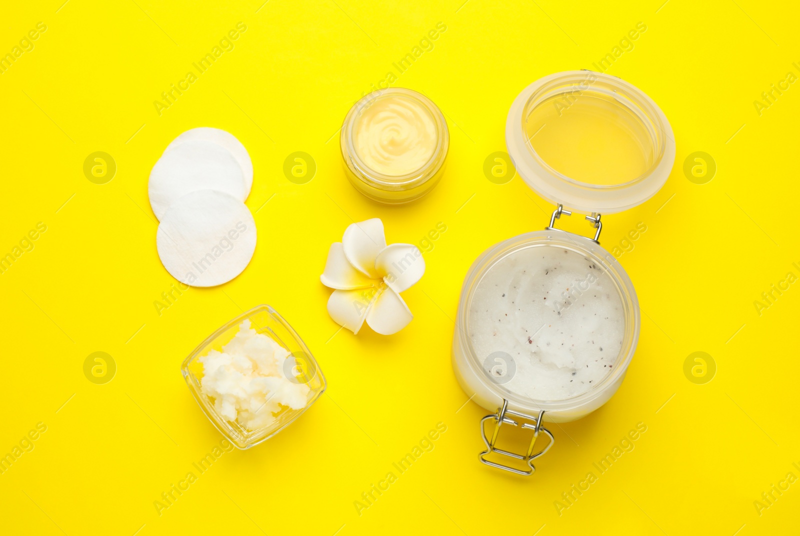 Photo of Flat lay composition with beeswax cosmetics on yellow background