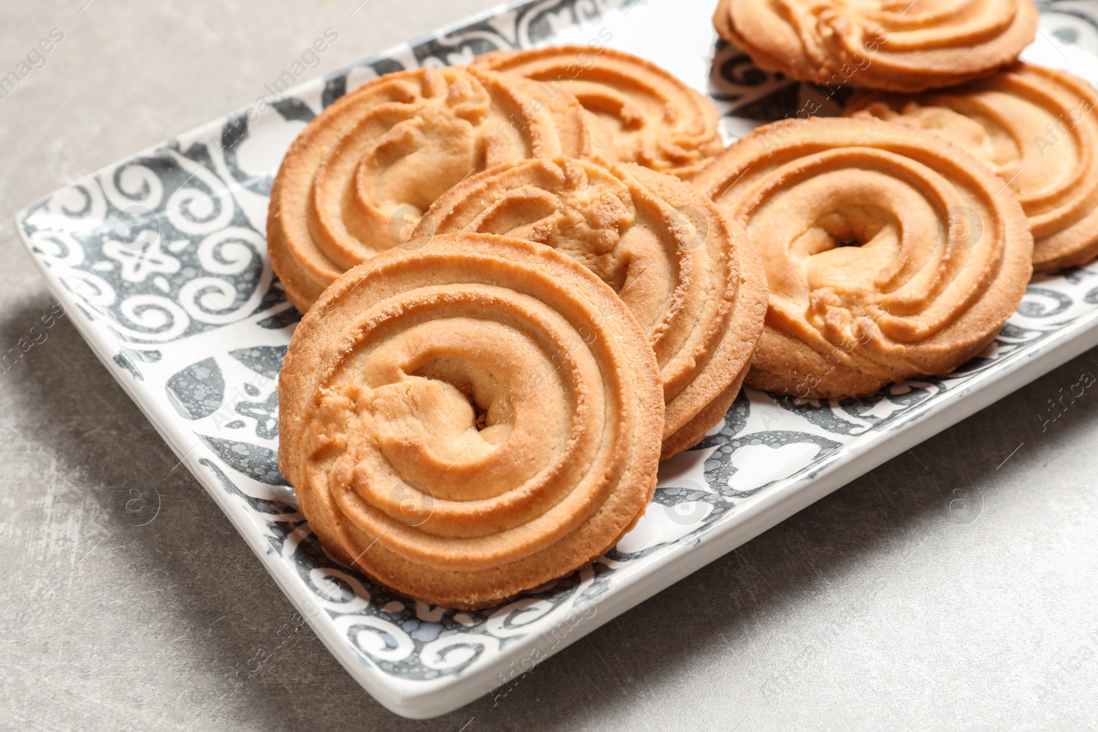 Photo of Plate with Danish butter cookies on table, closeup