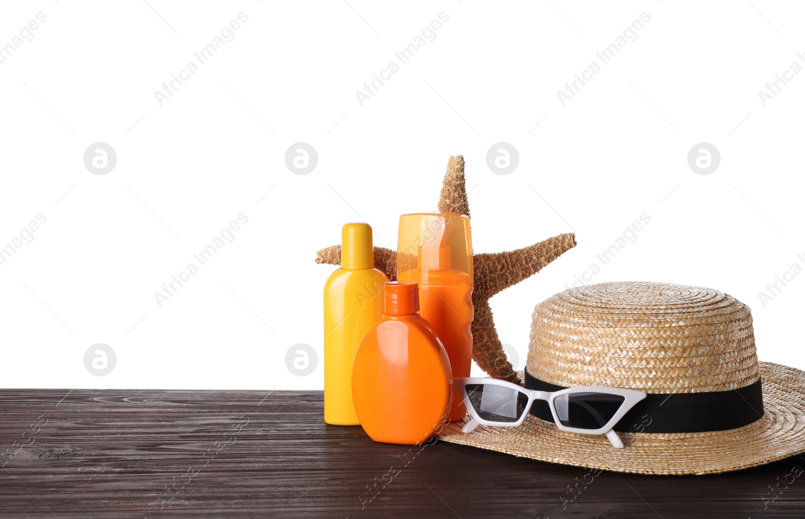 Photo of Composition with sun protection products on wooden table against white background. Space for text