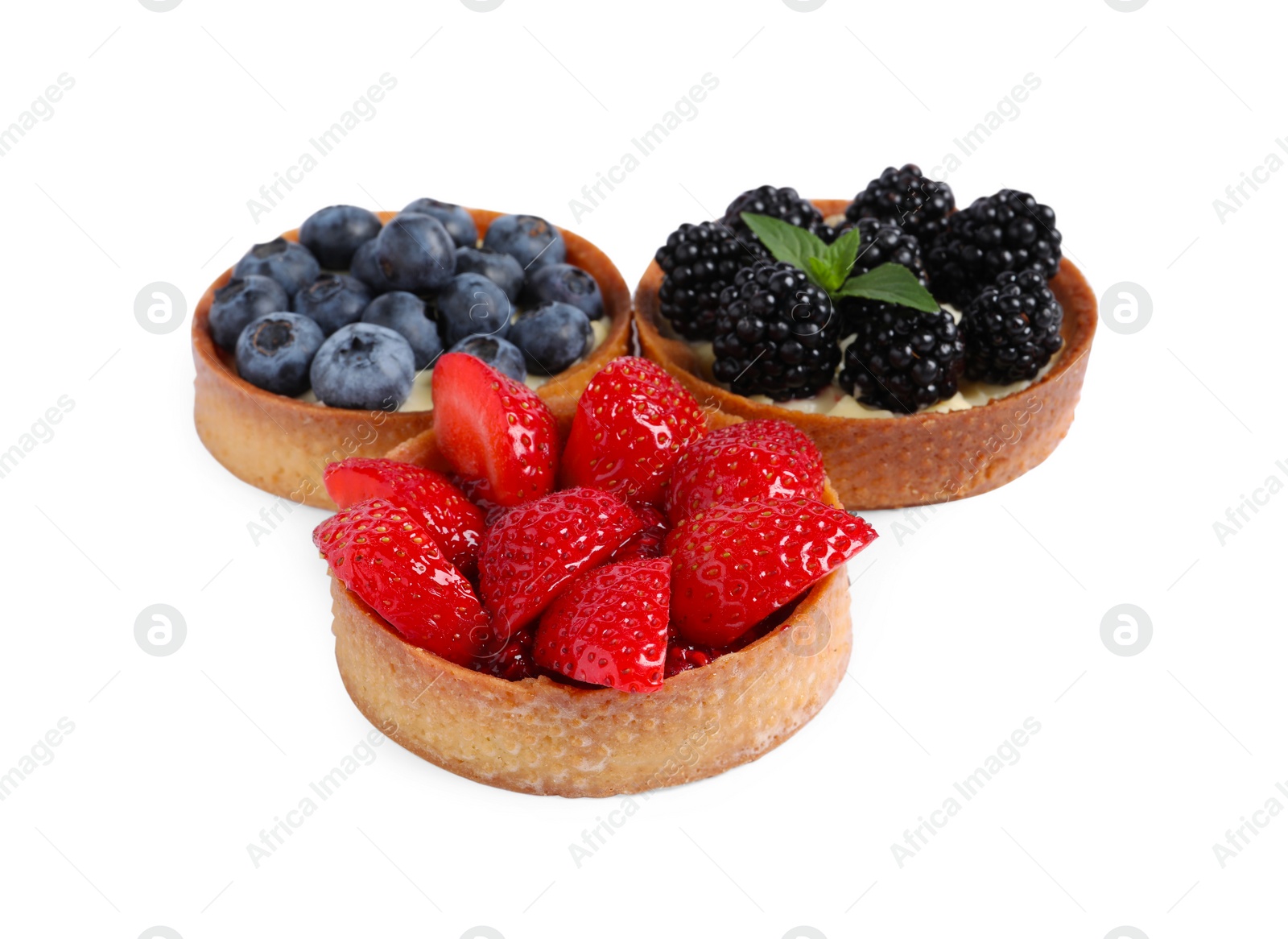 Photo of Tartlets with different fresh berries isolated on white. Delicious dessert