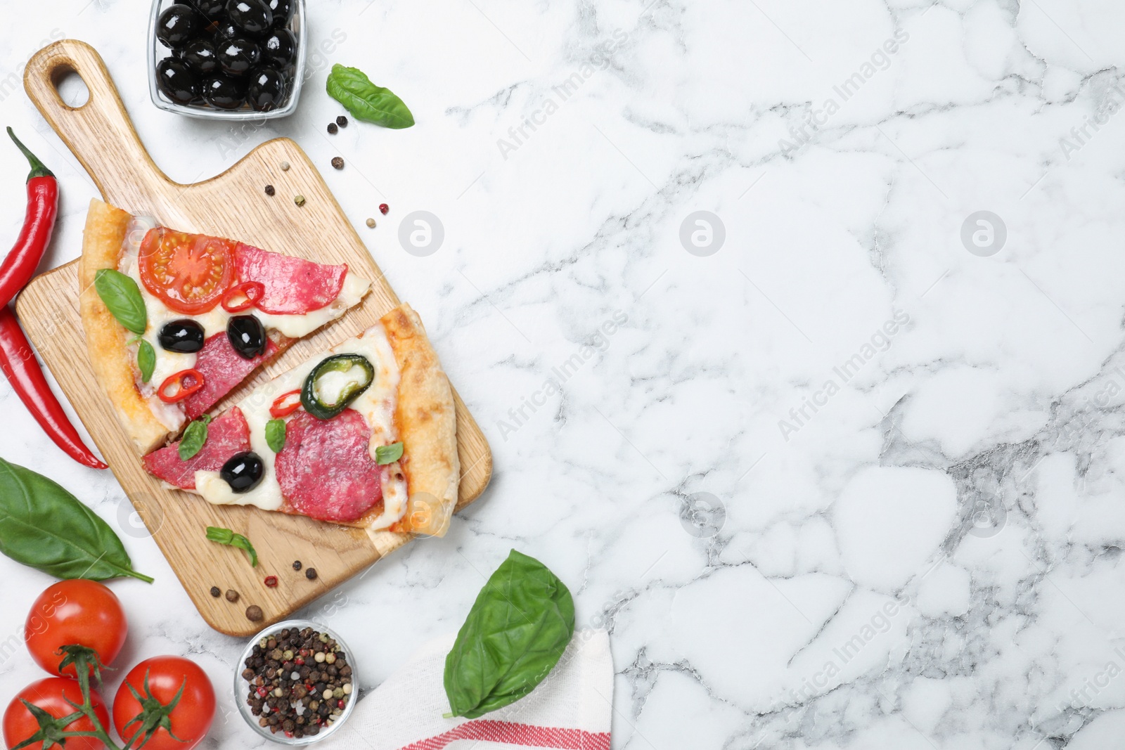 Photo of Flat lay composition with pieces of delicious pizza Diablo and ingredients on white marble background. Space for text