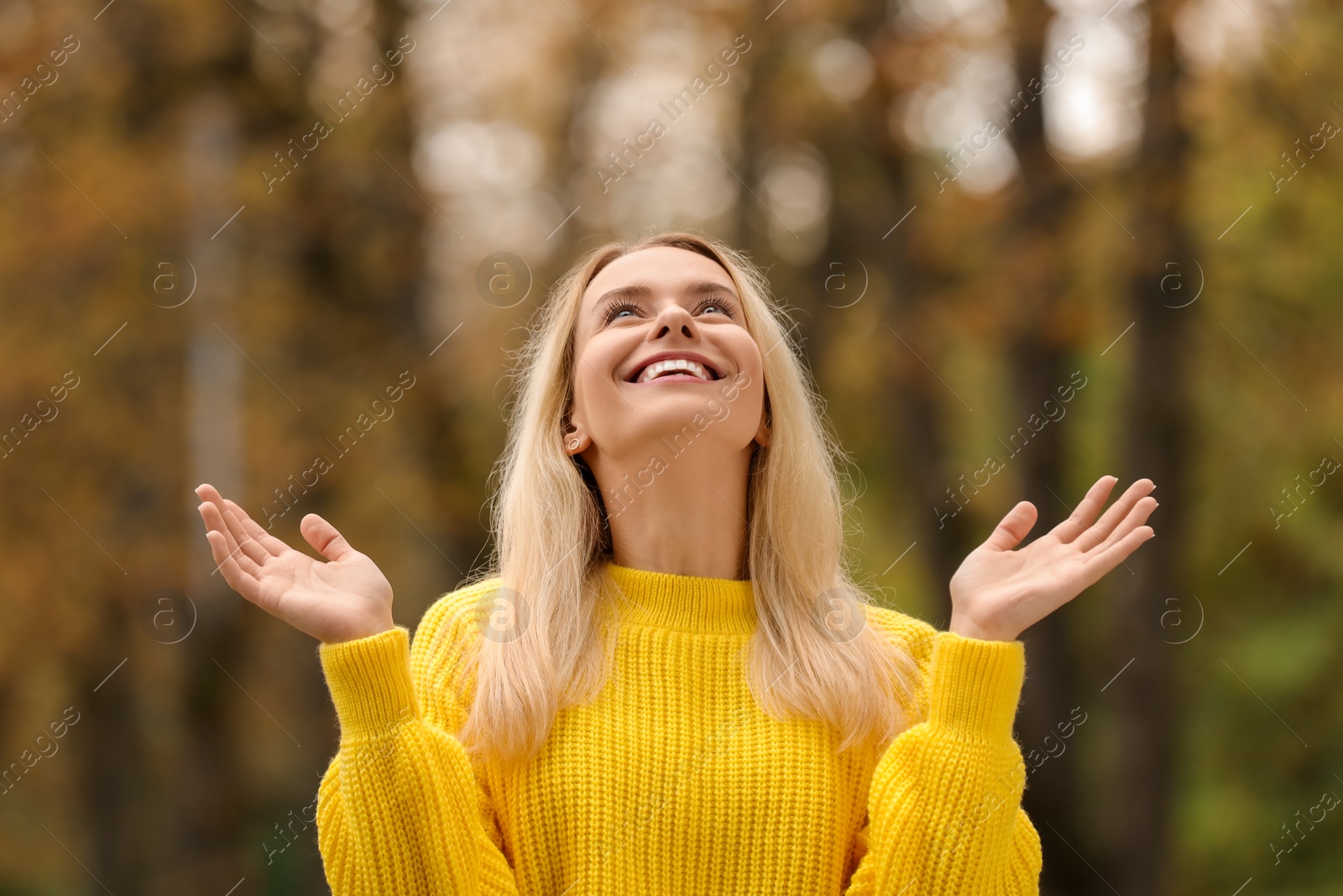 Photo of Autumn vibes. Portrait of happy woman outdoors