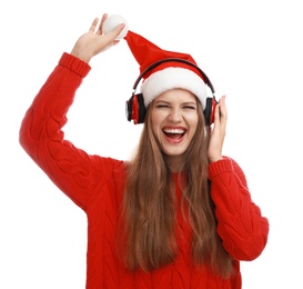 Photo of Young woman in Santa hat listening to Christmas music on white background