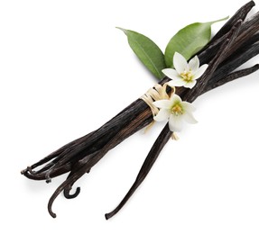 Photo of Vanilla pods, green leaves and flowers isolated on white, above view