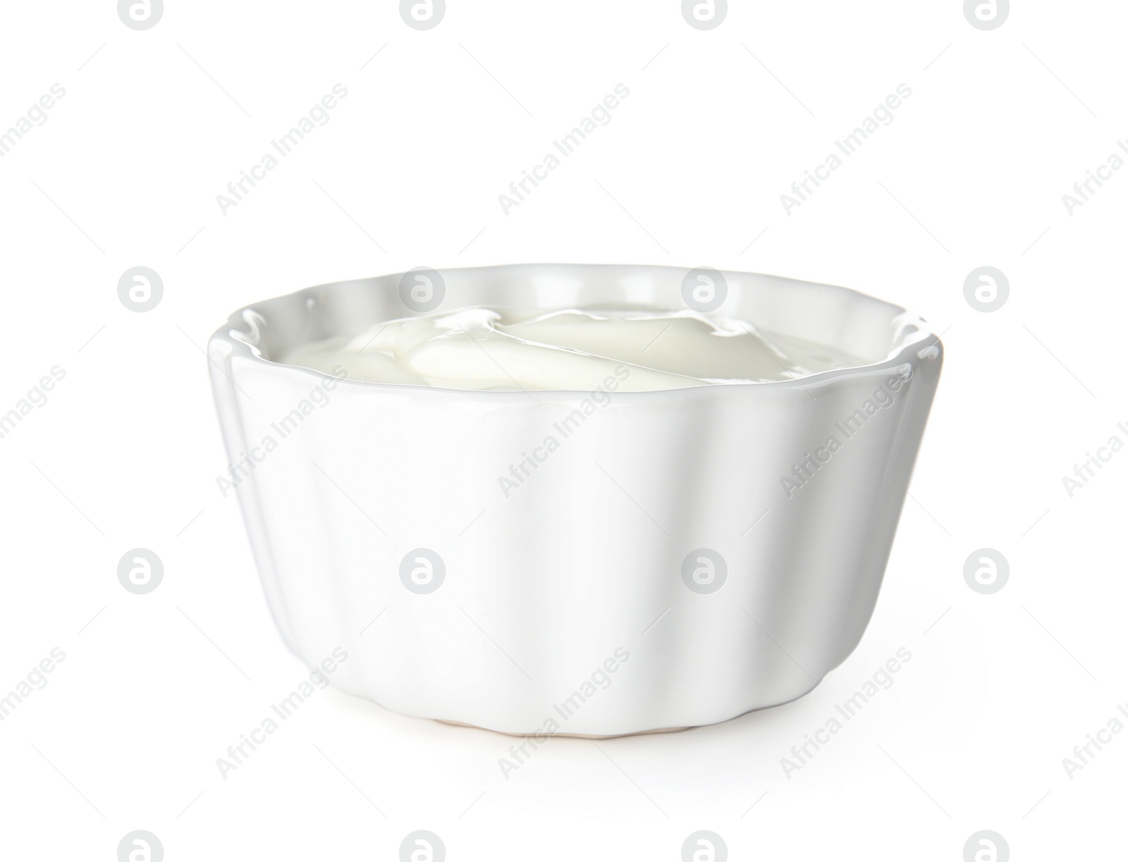 Photo of Bowl with creamy yogurt on white background