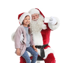 Photo of Authentic Santa Claus taking selfie with little girl on white background