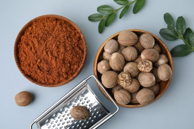 Flat lay composition with nutmegs on white background