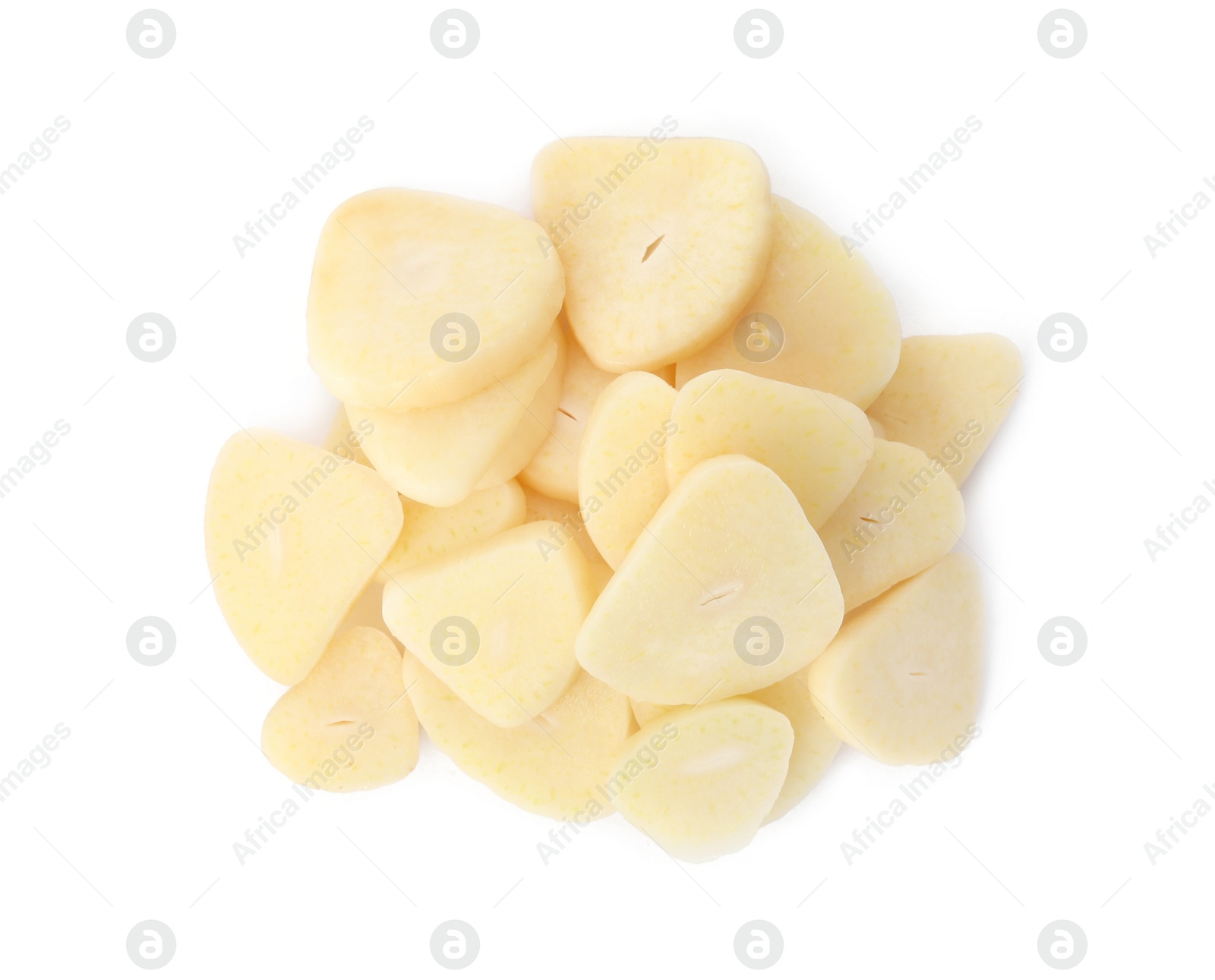 Photo of Pile of fresh sliced garlic cloves isolated on white, top view. Organic food