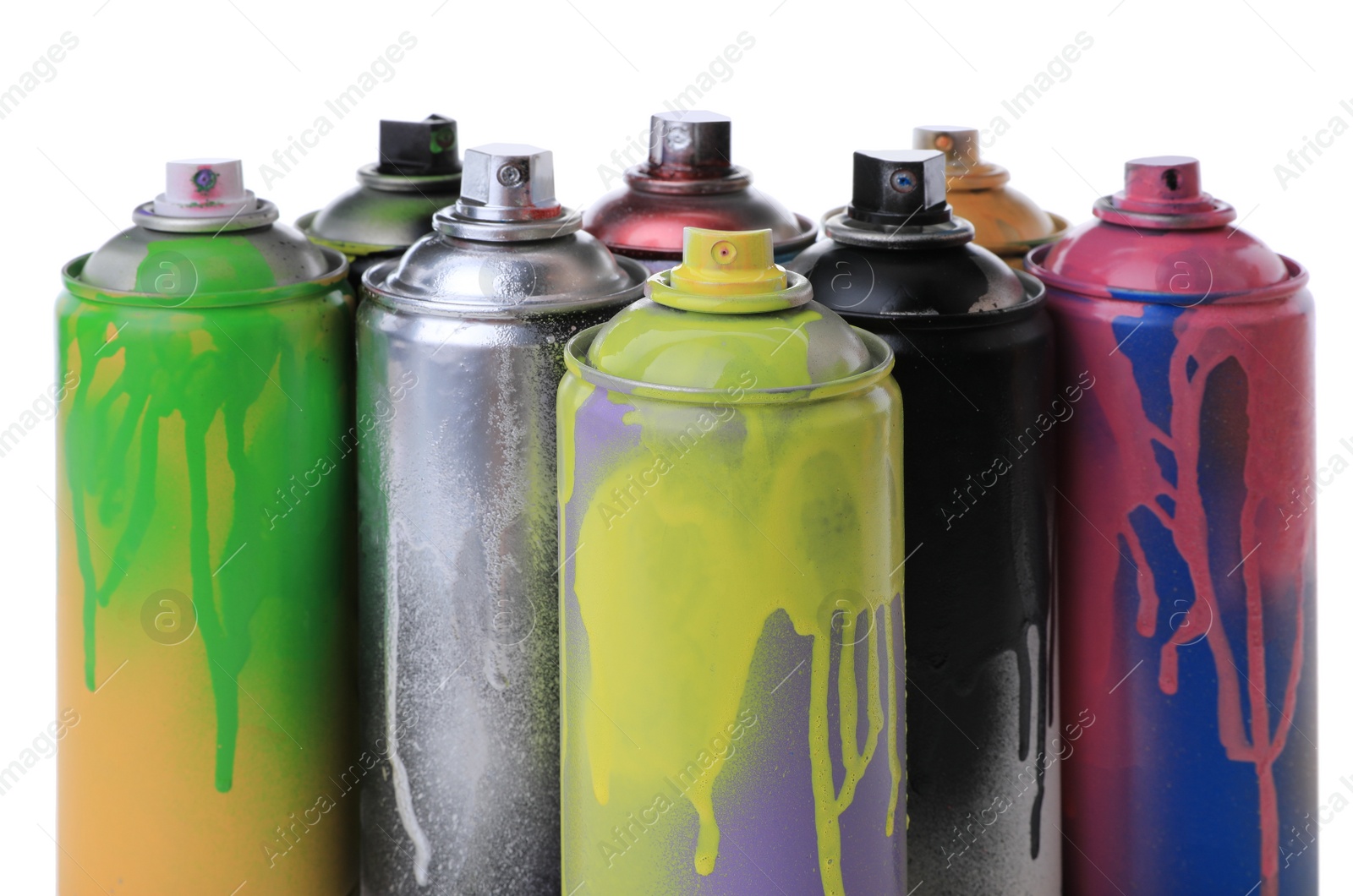 Photo of Used cans of spray paints on white background. Graffiti supplies