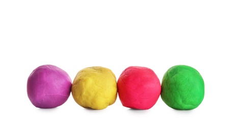 Photo of Colorful play dough on white background