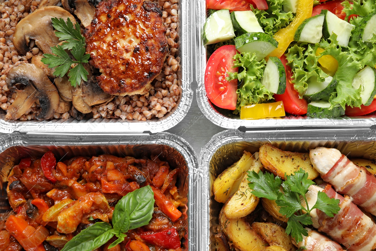 Photo of Lunchboxes on table, flat lay. Healthy food delivery