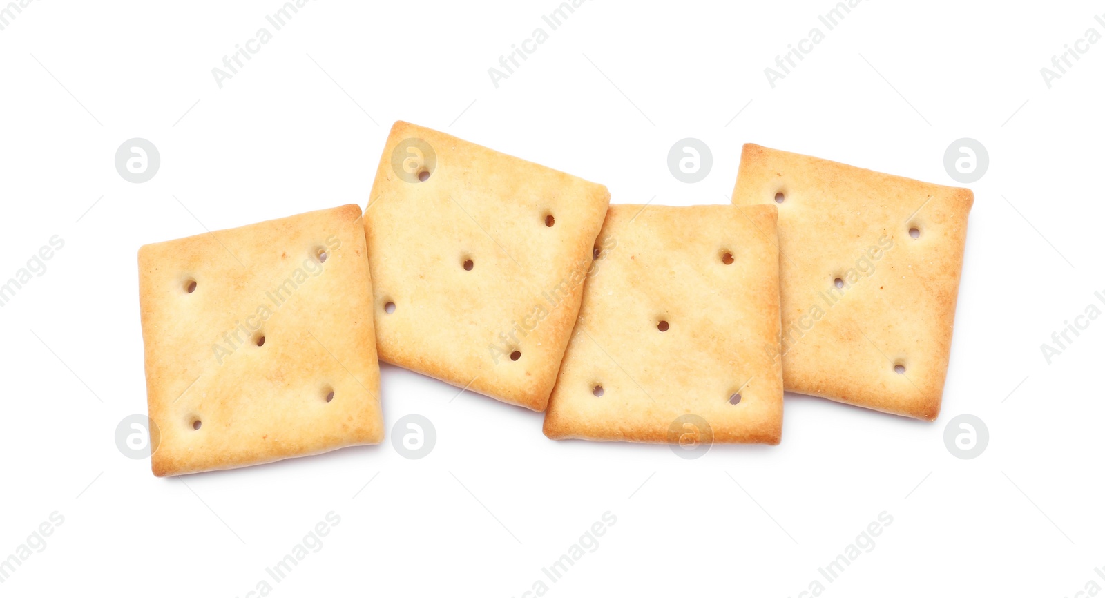 Photo of Tasty crispy square crackers isolated on white, top view