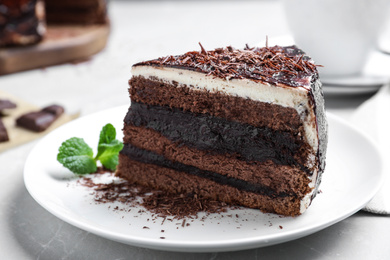 Photo of Tasty chocolate cake served on table, closeup