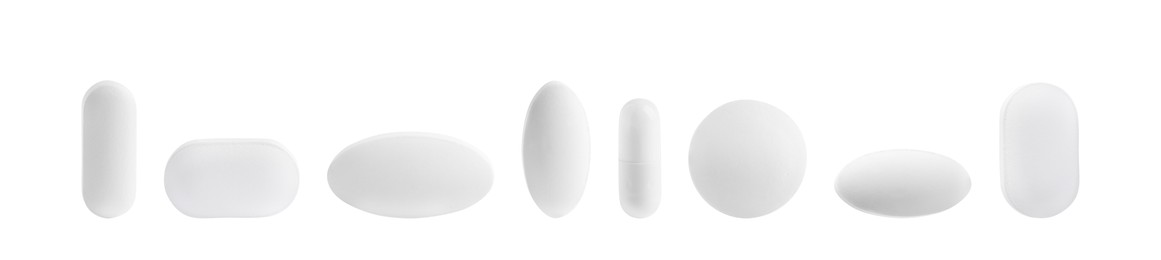 Image of Set of different pills in row isolated on white