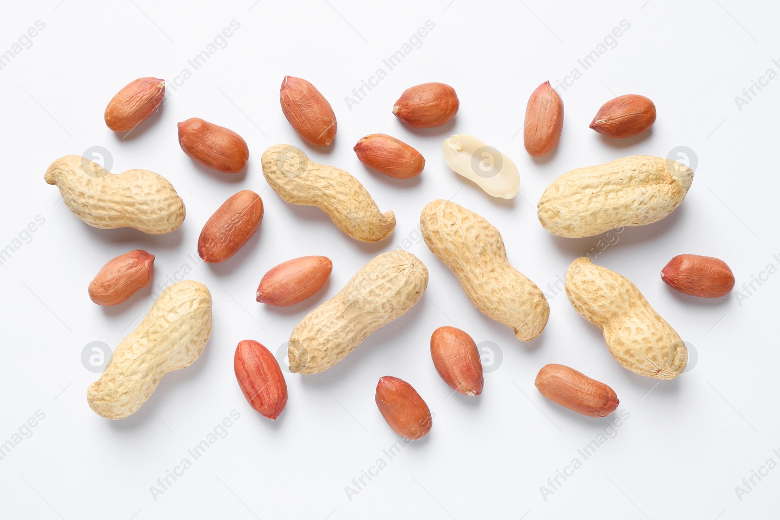 Photo of Fresh peanuts on white background, flat lay